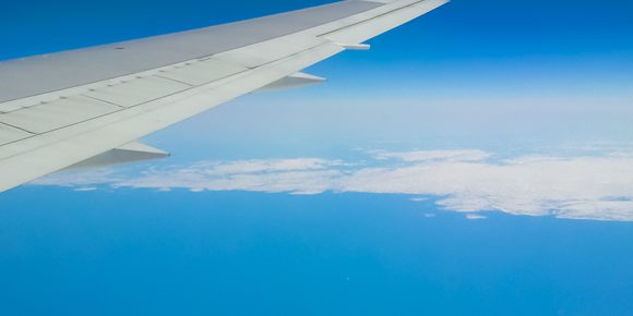 ViewOfEarthFromAirplaneWindowAtWing